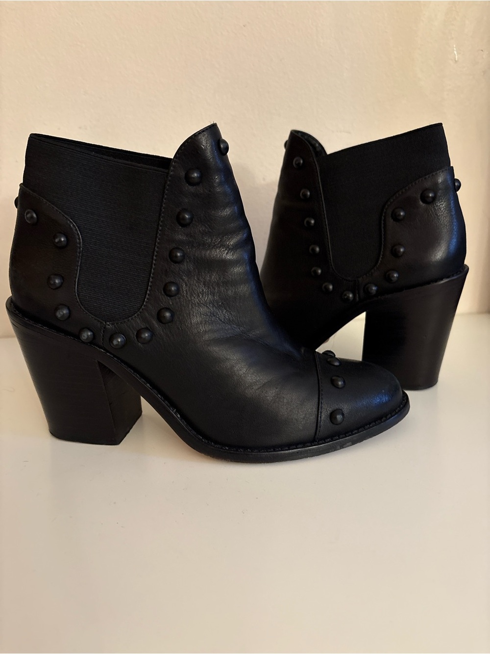 Lblack leather Loeffler Randall Emerson Booties stand out with their edgy, dark